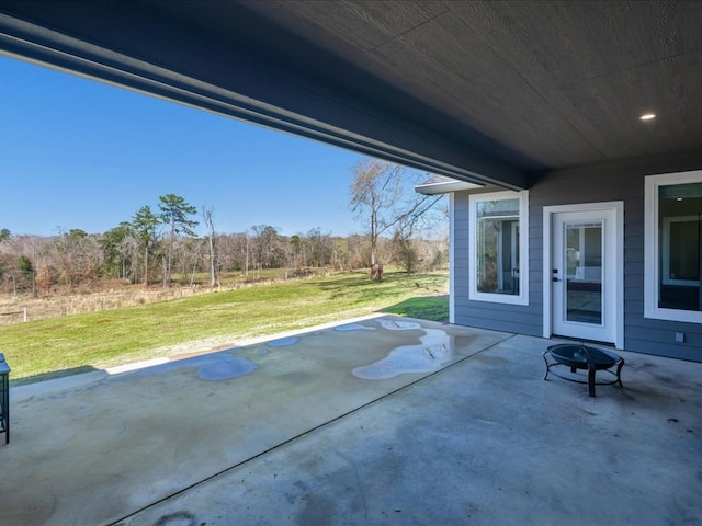 view of patio with a fire pit