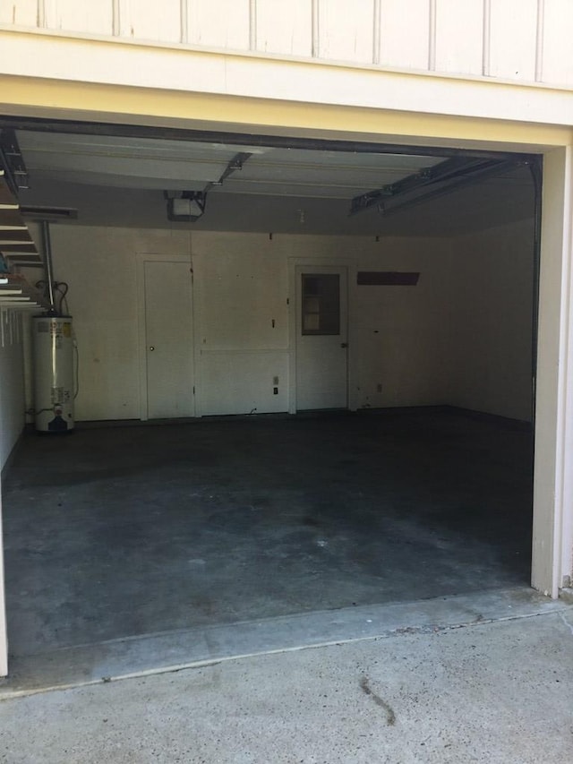 garage featuring a garage door opener and gas water heater