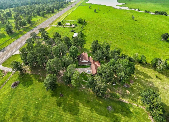 birds eye view of property with a rural view