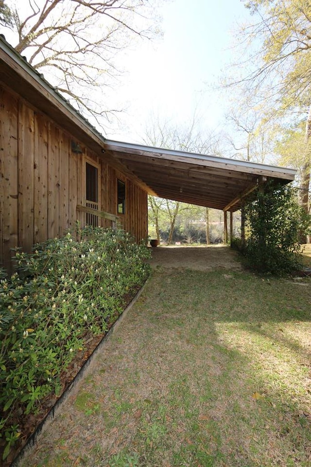 view of vehicle parking with a carport