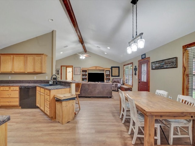 kitchen with dishwasher, dark countertops, open floor plan, decorative light fixtures, and a sink