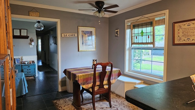 622 Egret Dr, Nacogdoches, TX 75964 - dining space featuring a ceiling fan, ornamental molding, and dark tile patterned flooring