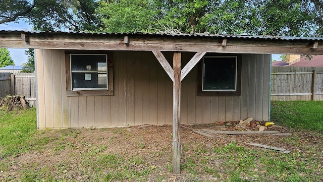 622 Egret Dr, Nacogdoches, TX 75964 - view of side of home with an outdoor structure and metal roof