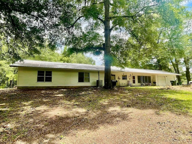 back of property featuring cooling unit