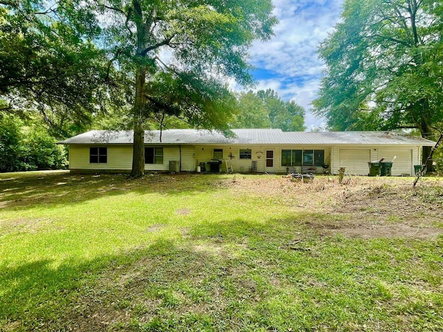 exterior space with a garage and a front yard