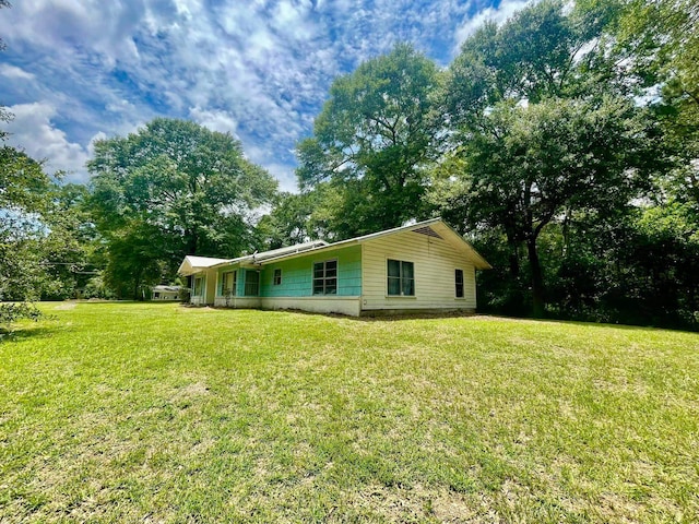 view of home's exterior featuring a lawn