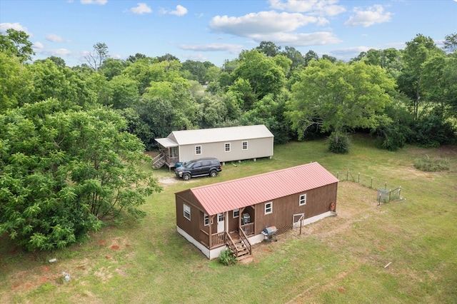 birds eye view of property with a forest view
