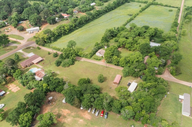 birds eye view of property with a rural view