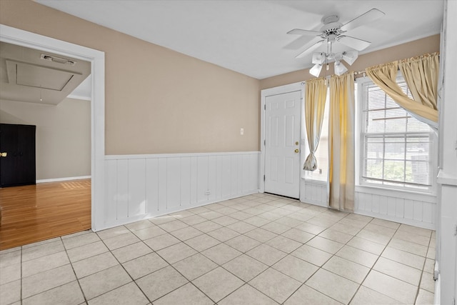 foyer with ceiling fan and light hardwood / wood-style floors