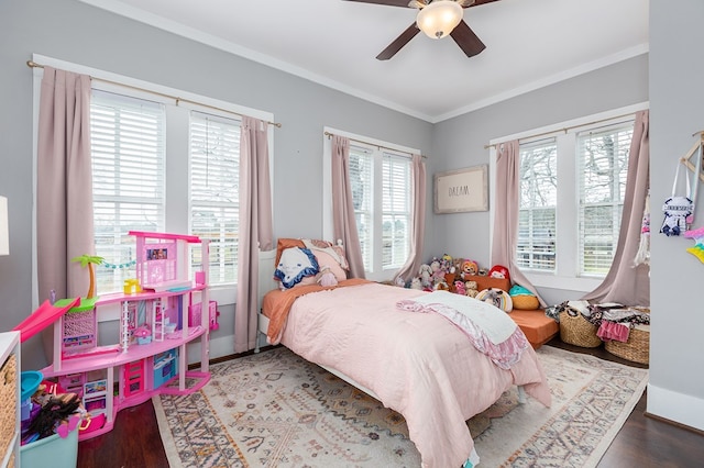 bedroom with ceiling fan, ornamental molding, and wood finished floors