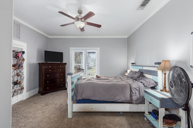 bedroom with carpet, visible vents, and crown molding