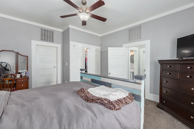 bedroom with carpet floors, ceiling fan, visible vents, and crown molding