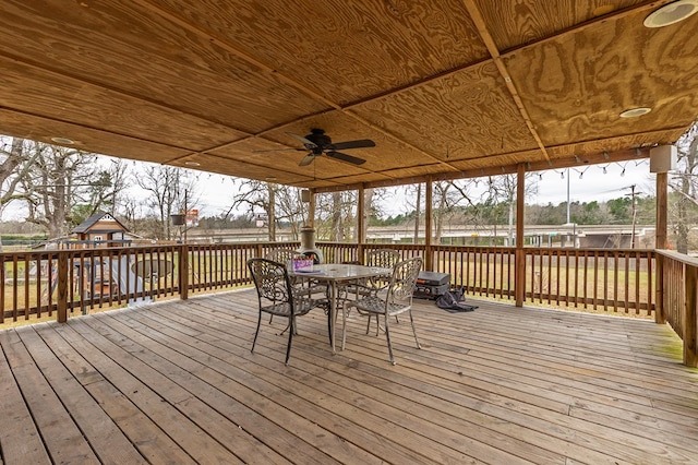 deck featuring a ceiling fan and outdoor dining space