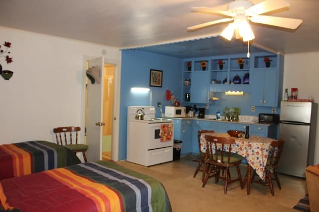 bedroom with stainless steel refrigerator and ceiling fan