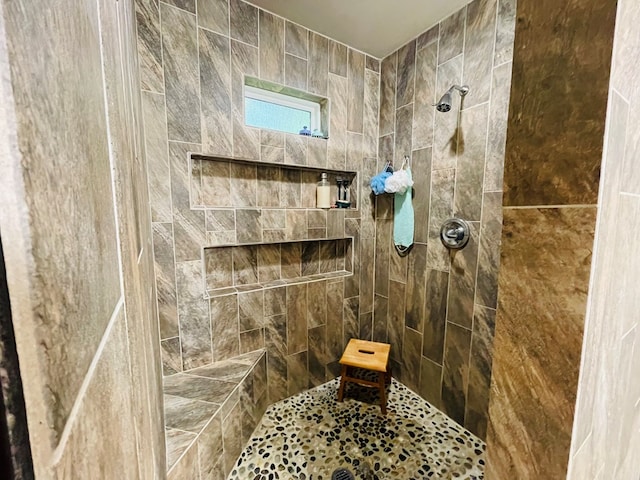 bathroom featuring tiled shower