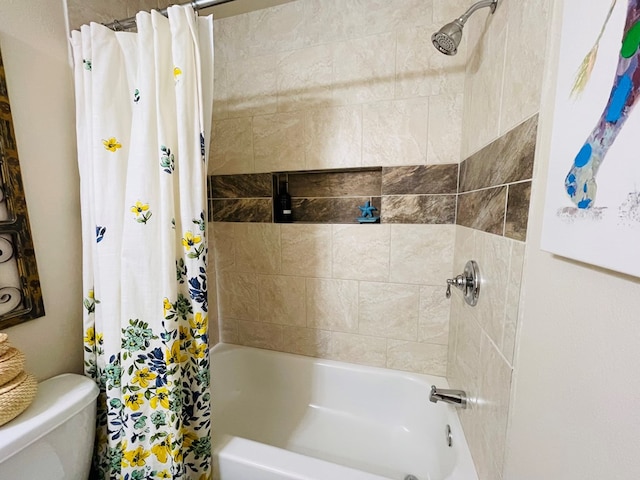 bathroom with shower / bath combination with curtain and toilet