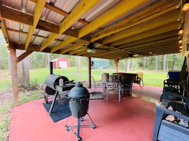 view of patio featuring a shed