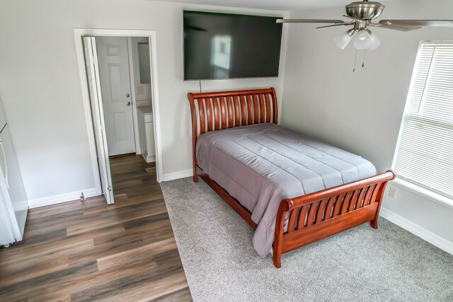 bedroom featuring dark hardwood / wood-style flooring and ceiling fan