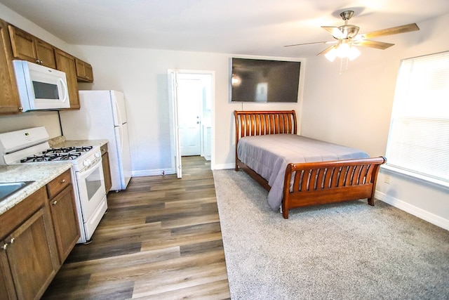 bedroom with ceiling fan and wood-type flooring