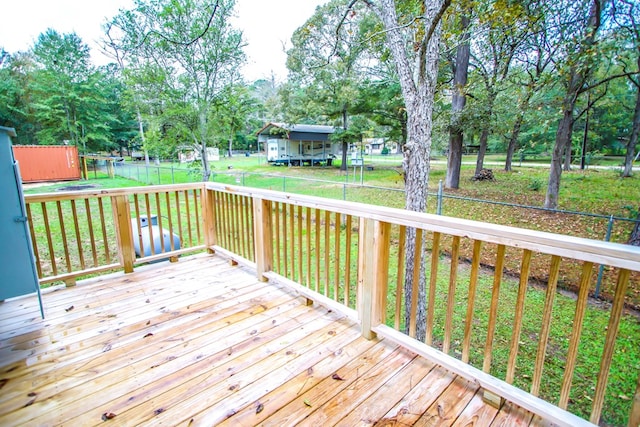 wooden terrace with a yard