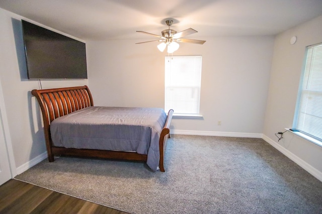 bedroom featuring hardwood / wood-style floors and ceiling fan