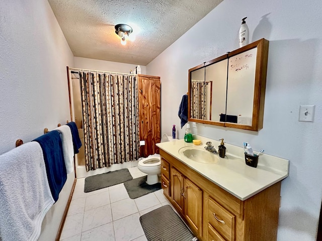 bathroom with vanity, tile patterned floors, toilet, a textured ceiling, and curtained shower