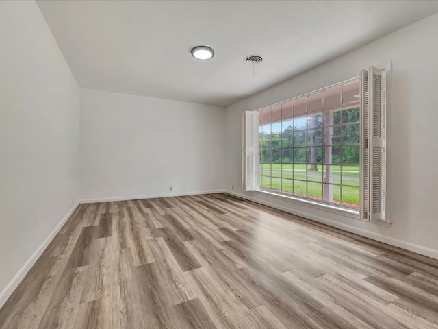 spare room featuring light wood-type flooring