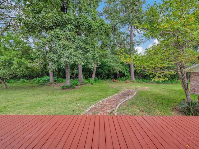 wooden terrace with a yard