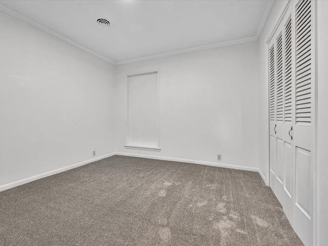 unfurnished bedroom featuring carpet floors and crown molding