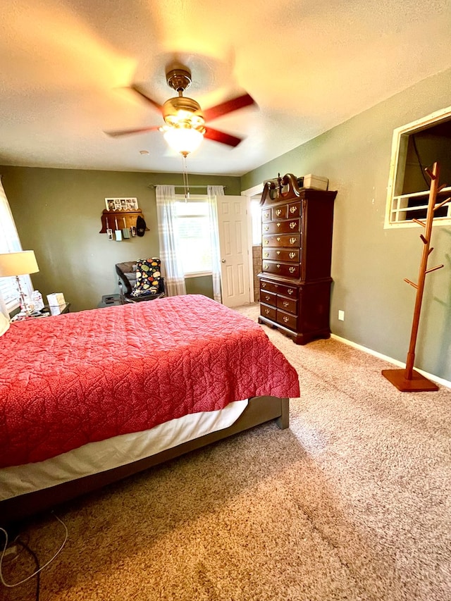 708 Card Dr, Lufkin, TX 75901 - carpeted bedroom with a ceiling fan and a textured ceiling