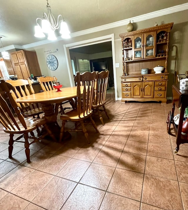 708 Card Dr, Lufkin, TX 75901 - dining room featuring ornamental molding, light tile patterned floors, and a notable chandelier