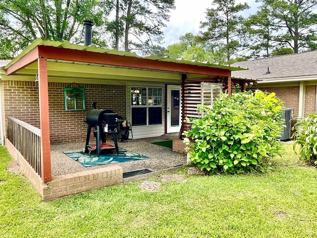 708 Card Dr, Lufkin, TX 75901 - exterior space with a yard, brick siding, and cooling unit