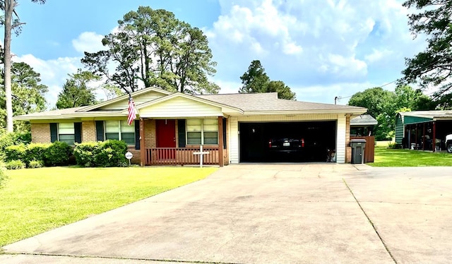 708 Card Dr, Lufkin, TX 75901 - ranch-style home with a porch, driveway, a front lawn, and a garage
