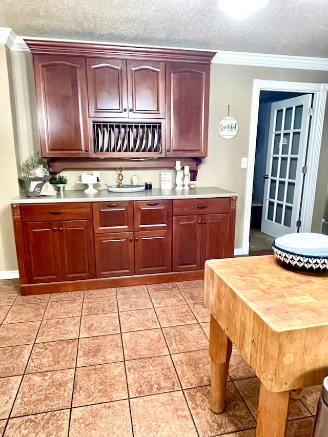 708 Card Dr, Lufkin, TX 75901 - bar with ornamental molding, a textured ceiling, and light tile patterned floors