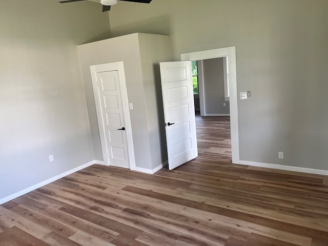 505 N 1st St, Lufkin, TX 75901 - empty room with a high ceiling, wood finished floors, and ceiling fan