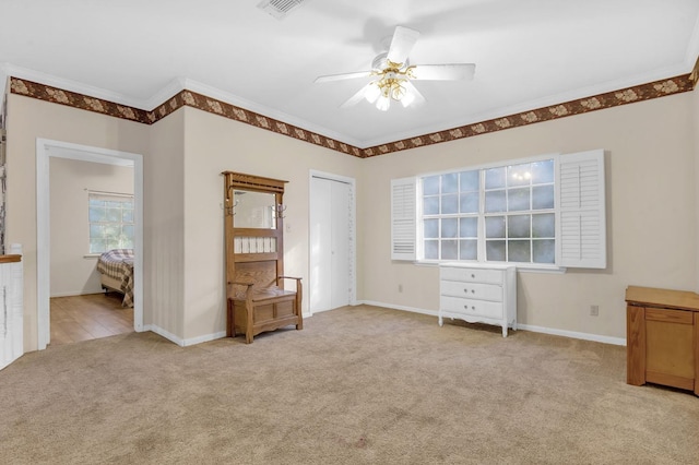 7332 Fm 252, Jasper, TX 75951 - unfurnished bedroom with light carpet, ornamental molding, ceiling fan, and a closet