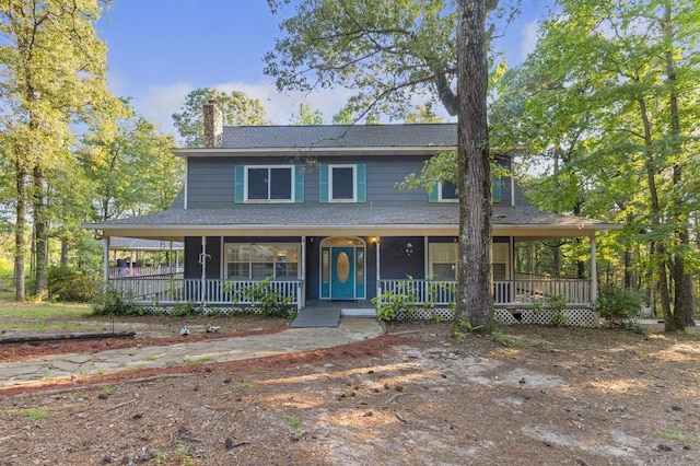 7332 Fm 252, Jasper, TX 75951 - farmhouse with a chimney, covered porch, and roof with shingles