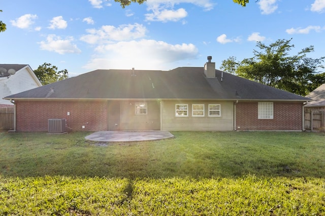 126 Lewellin Pl, Lufkin, TX 75904 - rear view of house featuring brick siding, a patio, and a chimney