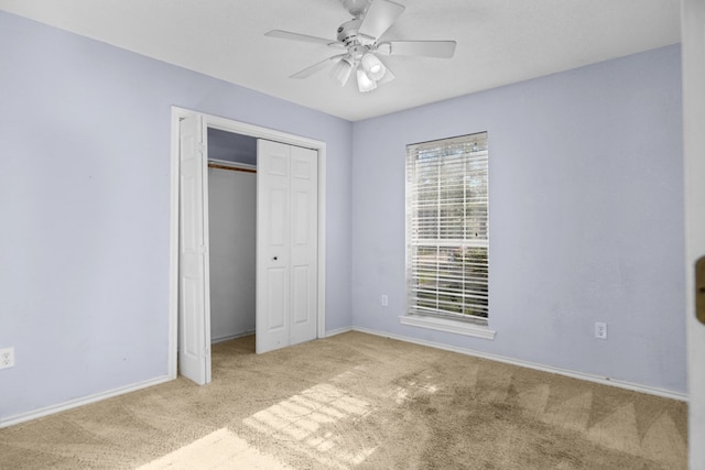 126 Lewellin Pl, Lufkin, TX 75904 - unfurnished bedroom featuring carpet, multiple windows, a closet, and a ceiling fan