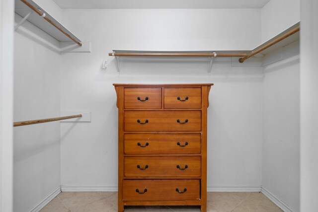 126 Lewellin Pl, Lufkin, TX 75904 - walk in closet with light tile patterned flooring