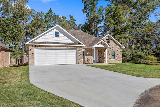 view of front of house featuring a garage and a front lawn