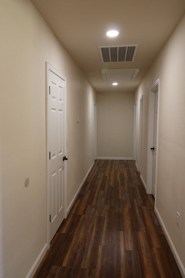 corridor featuring dark hardwood / wood-style flooring