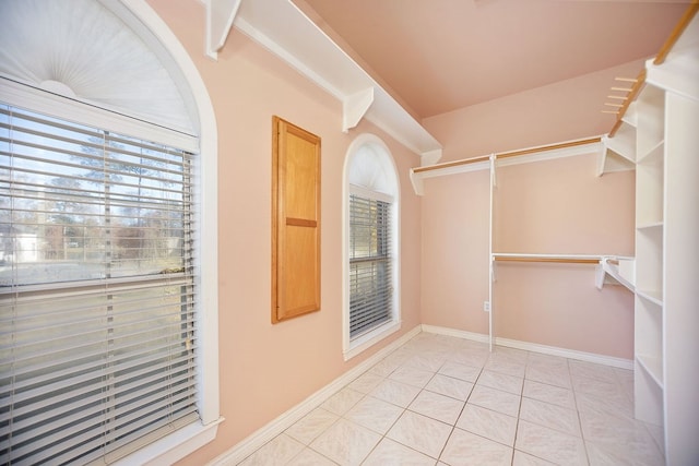 spacious closet with light tile patterned flooring