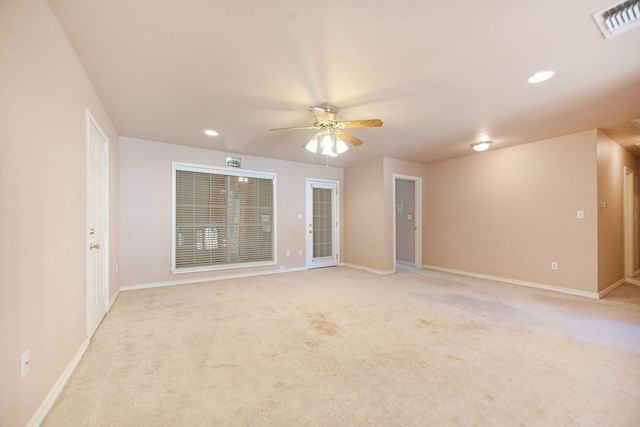 empty room featuring light carpet and ceiling fan