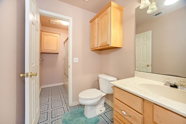 full bathroom featuring bath / shower combo with glass door, vanity, and toilet