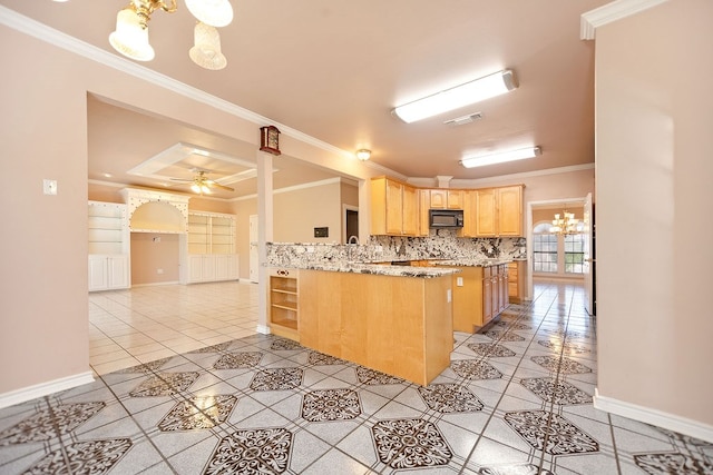 kitchen with crown molding, ceiling fan with notable chandelier, light brown cabinetry, and kitchen peninsula