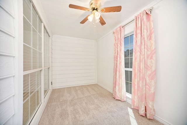 carpeted empty room with ceiling fan