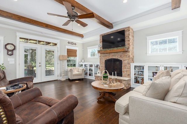 living area featuring a fireplace, french doors, ornamental molding, beam ceiling, and dark wood-style floors