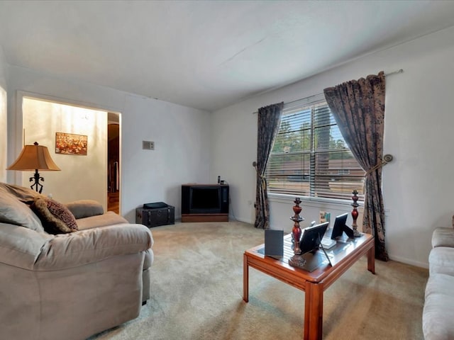 living room featuring light carpet