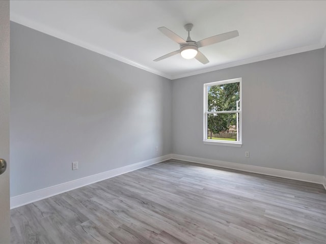 empty room featuring light hardwood / wood-style floors, ceiling fan, and crown molding